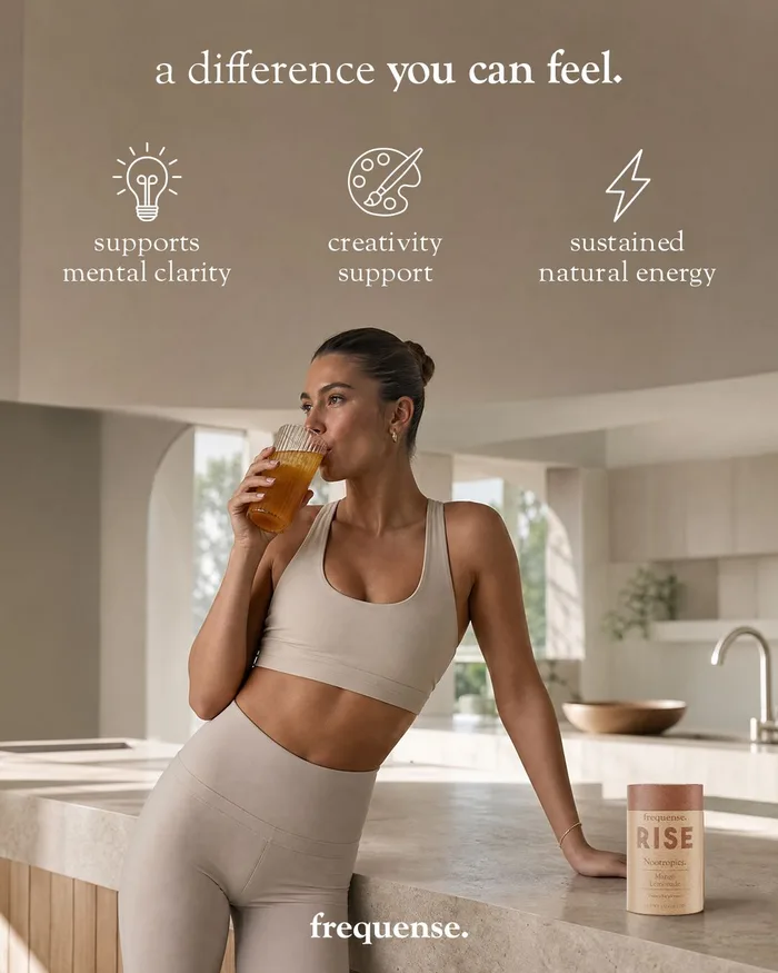 Woman holding a drink beside a RISE tub